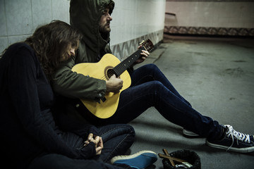 Homeless Couple Man Playing Guitar Asking For Money Donation