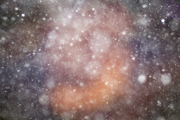Snowfall texture of snowflakes on blurred background