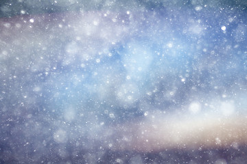 Snowfall texture of snowflakes on blurred background