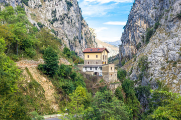 Fototapeta na wymiar The Rio Cares Gorge in the National Park Los Picos de Europa. The mountain stream is known because of the narrow and spectacular canyon it forms when passing the Picos de Europa