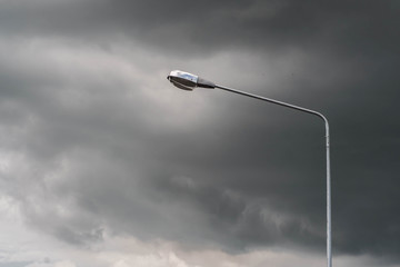 lamp post with black cloud background