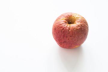 Spoiled apple on white background