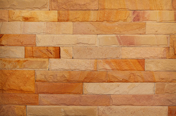 Pattern of rough sandstone wall texture for background and design.