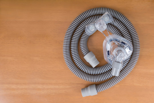 Pair Of CPAP Mask And Tubing..Cleaning Cpap Mask And Tubing Is A Routine Job,flat Lay..