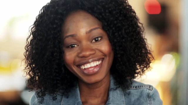 face of happy smiling afro american woman