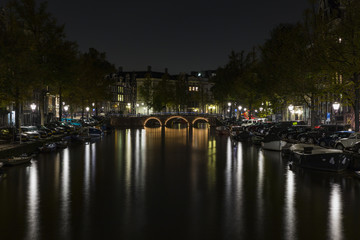 Leidsegracht bridge over Keizersgracht canal at night