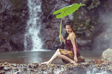 The girl was bathing brook,woman washing in the stream,country girl portrait in outdoors,beautiful happy Asian girl smile and laugh together.