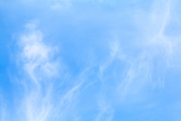 White clouds in the blue sky on a sunny day