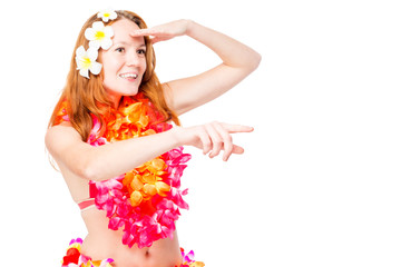 Woman looks and show to the side on a white background. Clothing in Hawaiian style