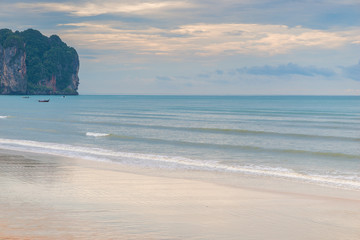 Fototapeta na wymiar View of the turquoise calm sea on a cloudy day. Andaman Sea, Thailand