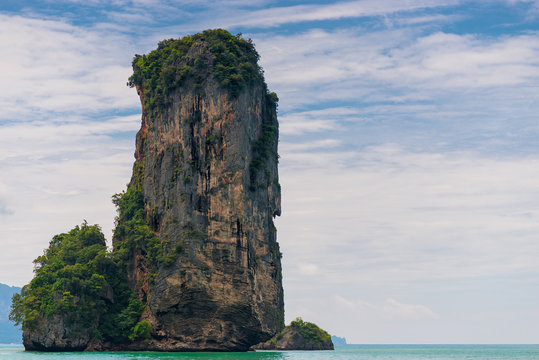 High cliff sticks out from the Andaman Sea near the resort of Krabi, Thailand
