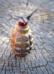 Old Hand Grenade on wood background