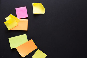 Color notes on black board, copy space