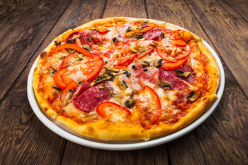 Delicious pizza with mushrooms and smoked chicken