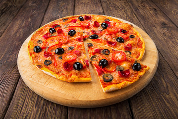 Delicious pizza with salami, mushrooms and olives