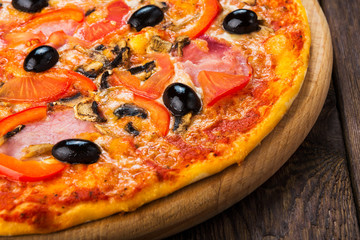 Delicious pizza with salami, mushrooms and olives