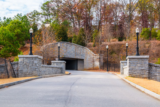 Evelyn St NE and the stone road tunnel in the Piedmont Park in autumn day, Atlanta, USA.