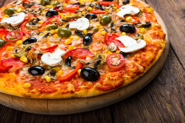 Delicious pizza with salami, mushrooms and olives