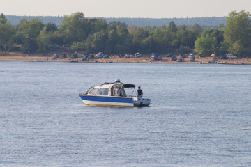 Boat of the Maritime police in charge of the beach which attracted many people to rest on the shore on a warm day