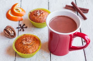 Muffins with walnuts and a cup of hot chocolate