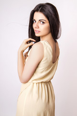 Fototapeta premium fashion style studio photo of a cute brunette, on white background.