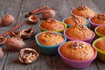 Obraz na płótnie Canvas Muffins with walnuts and cinnamon