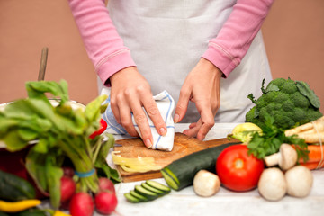 Woman cleaning chopping board