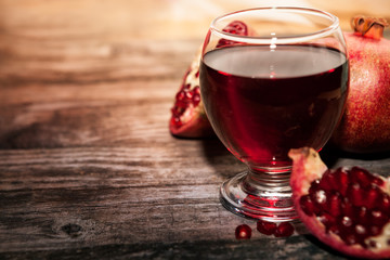 Glass of delicious and fresh pomegranate juice