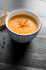 Carrot Soup Served in Bowl with Bread. Homemade Cream Carrot and Potato Pottage.