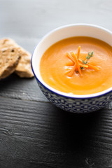 Carrot Soup Served in Bowl with Bread. Homemade Cream Carrot and Potato Pottage.