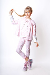 Cute girl teenage with long blond hair posing studio nature portrait.