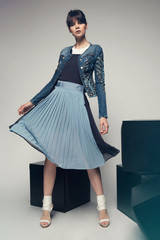 Model in a stylish skirt and jacket 