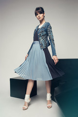 Model in a stylish skirt and jacket 