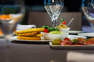 Bread and sauces on a plate in a restaurant