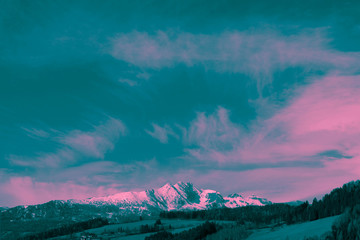 Photo depicting a beautiful moody frosty landscape. European alpine mountains with snow peaks on a...