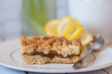Slice of key lime pie on a white plate. 