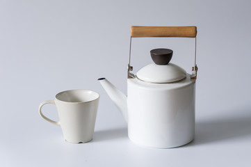 White kettles and cups, indoors