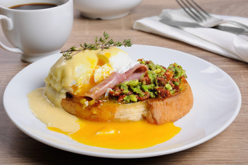 Toast with guacamole with egg Benedict