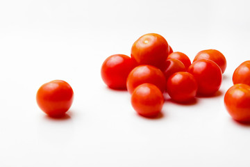 Red cherry tomatoes on a white background