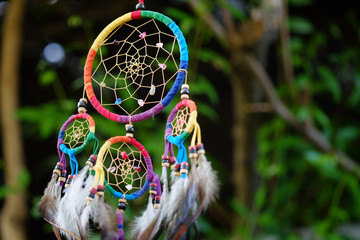Soft focus colorful dream catcher with natural background. Native american dream catcher. boho...