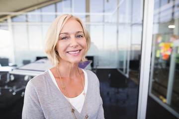 Portrait of mature businesswoman smiling in office