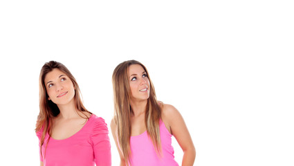 Two girls in pink looking up