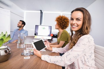 Smiling businesswoman using digital tablet 