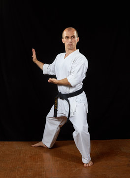 Karate athlete trains the blocks with his hands Kaderov