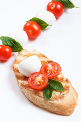 Bruschetta with cherry tomatoes, cherry mozzarella and basil.