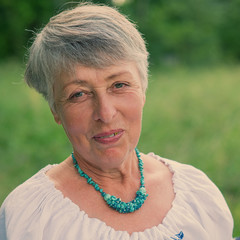 Portrait of a Smiling Woman in Age.
