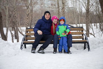 happy young family spending time outdoor in winter