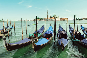 Venice cityscape view on Santa Maria della Salute basilica with gondolas