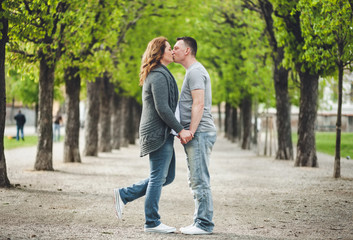 Fototapeta na wymiar Happy loving couple outdoors in a park