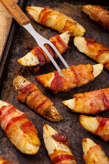 Bacon Wrapped Potatoes Wedges. Selective focus.